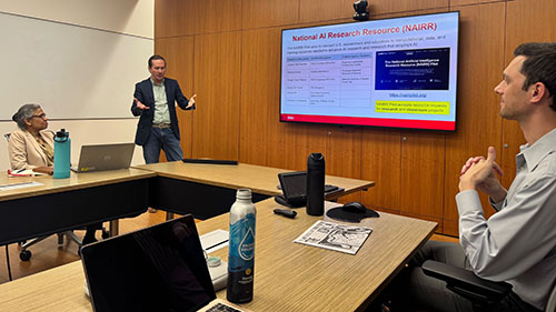 Michael Farley presents to faculty and staff about AI research resources during a Fowler College event.
