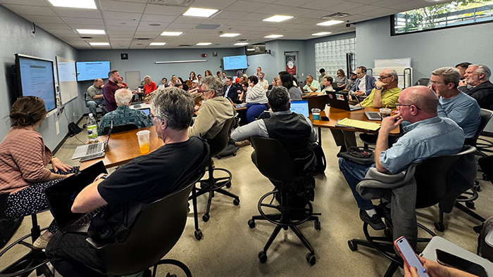 SDSU faculty members attentively participate in Faculty Champions Training, exploring AI tools and personalized instruction strategies during OpenAI Day.